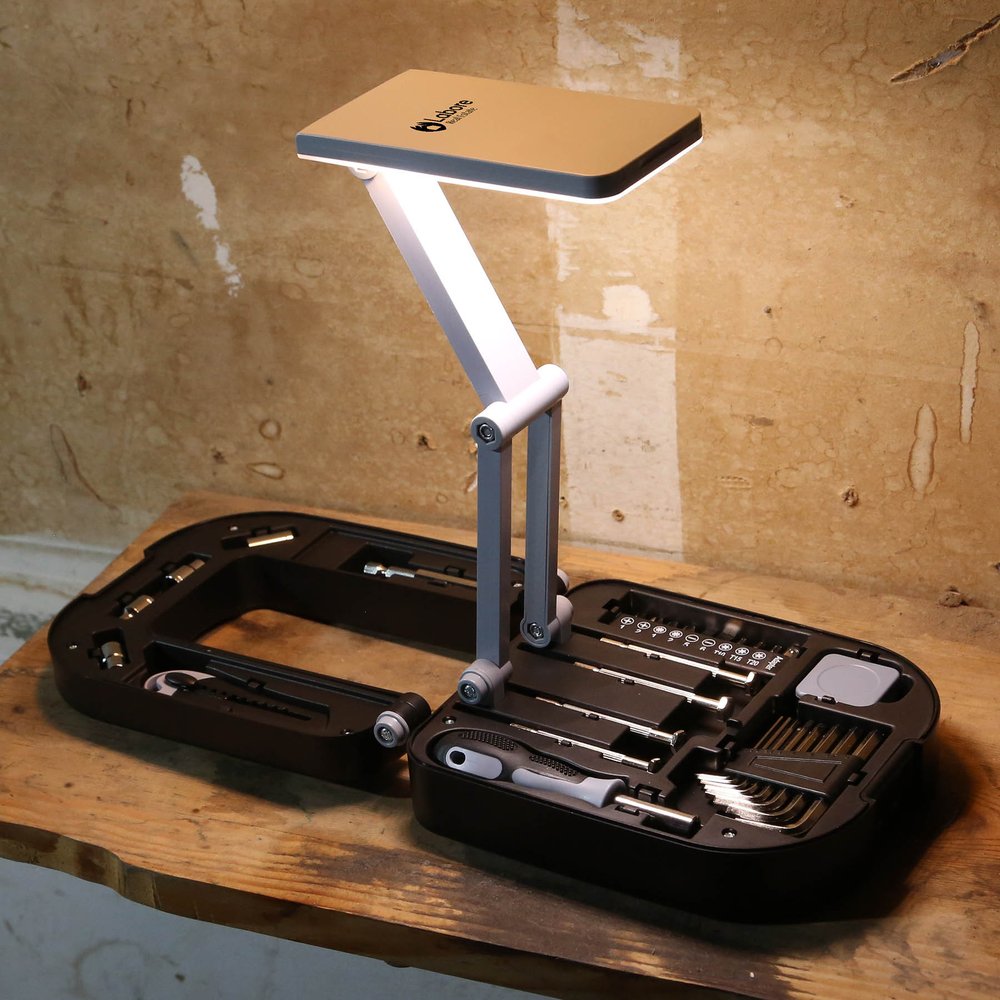 Open home toolkit case with a built-in LED lamp and tools