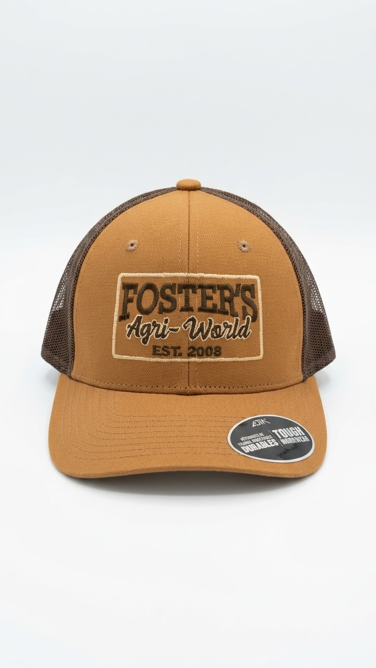 Foster's Agri-World patch inspired embroidery on a camel trucker hat
