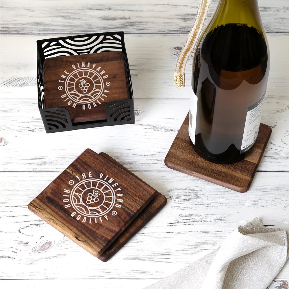 Wooden coaster set in a metal stand beside a bottle