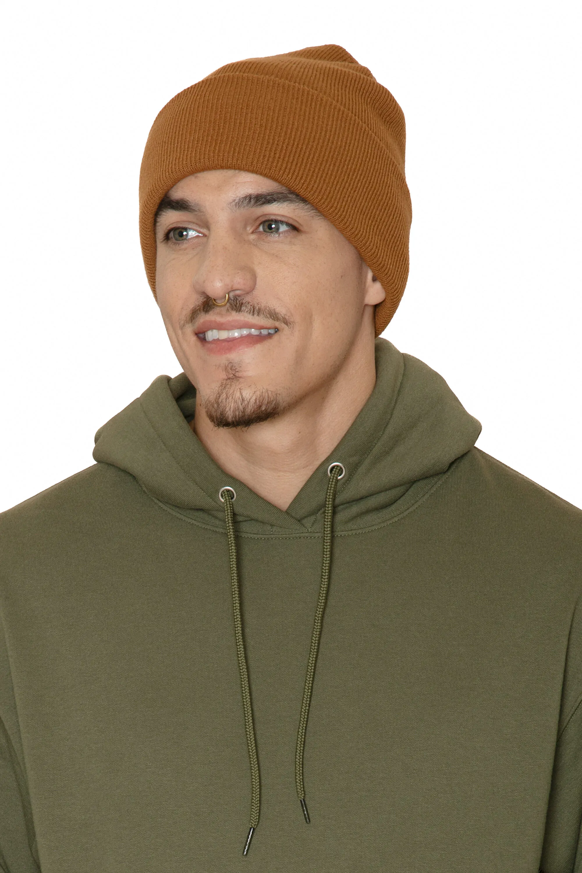 Man wearing a rust coloured knit cuff toque with an olive hoodie
